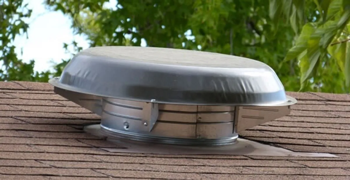 attic fan installation services with low-profile roof ventilation unit in Cleveland, OH