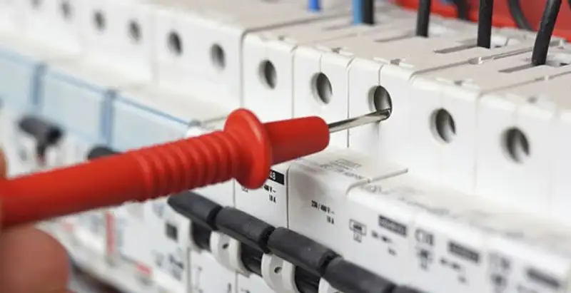 Electrical contractor testing circuit breakers during electrical repair in Maple Heights, OH