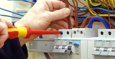 electrician services performing professional electrical panel wiring and connections in Cleveland, OH