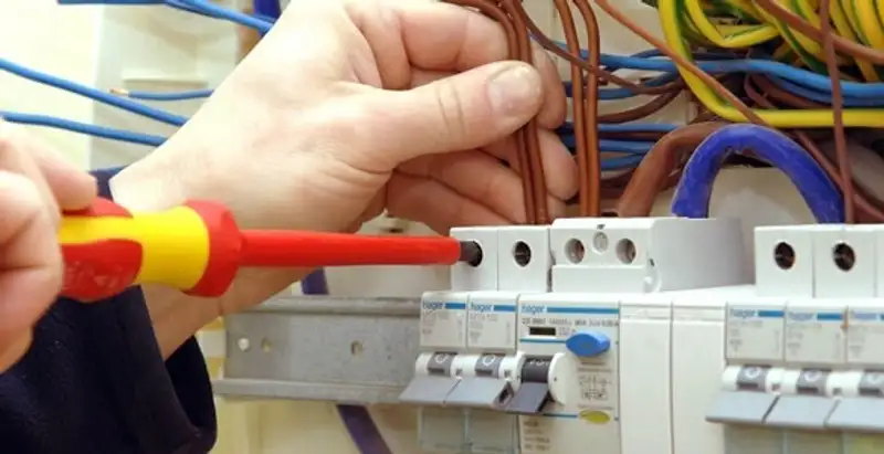 electrician services performing professional electrical panel wiring and connections in Cleveland, OH