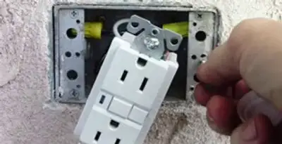 gfci circuits service showing installation of a ground fault circuit interrupter outlet by licensed electricians in Cleveland, OH
