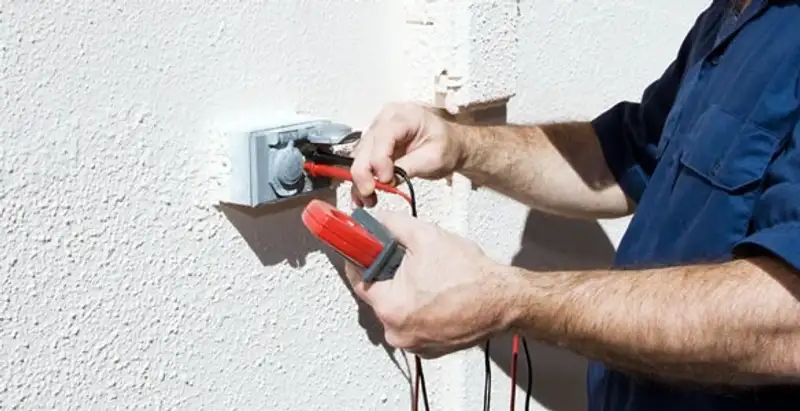 Electrician performing home electrical outlet and wiring inspection in Cleveland, OH