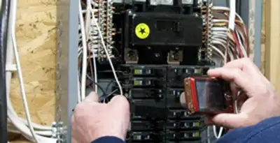 Home electrical inspection of circuit breaker panel by licensed electrician in Cleveland, OH