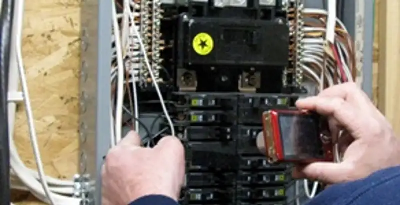 Home electrical inspection of circuit breaker panel by licensed electrician in Cleveland, OH