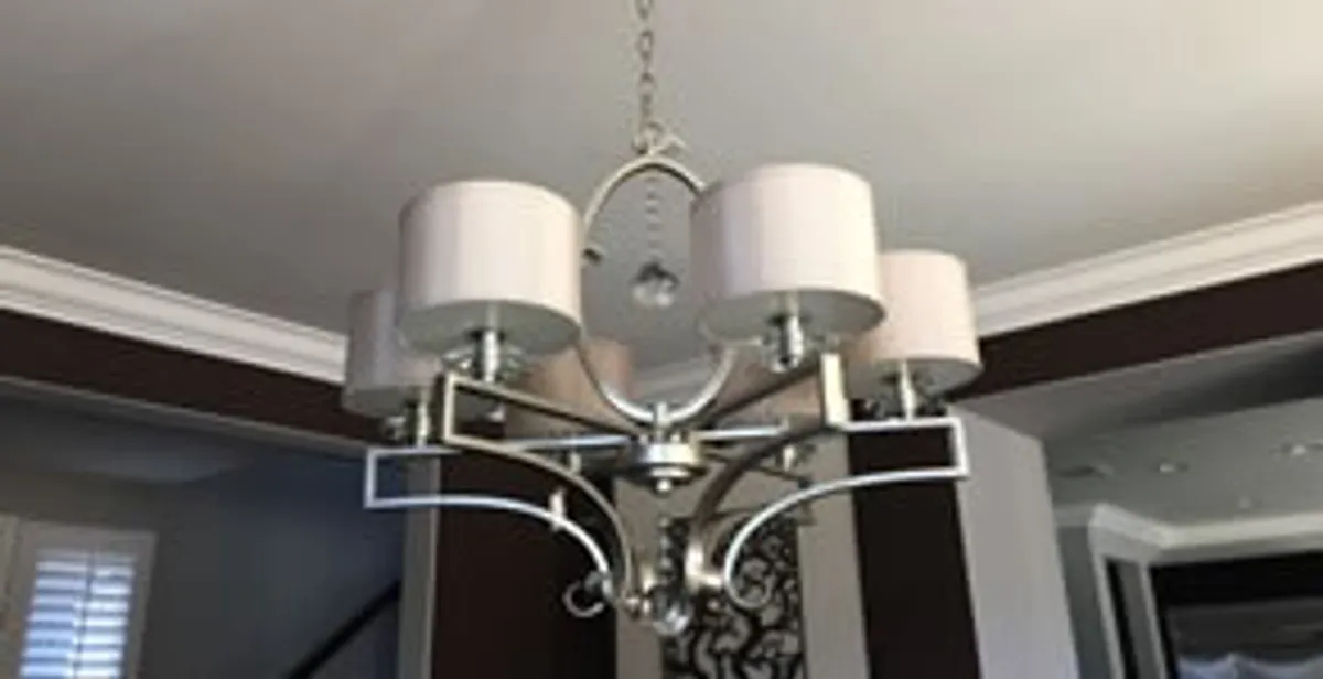 Modern chandelier installation with multiple light fixtures in Cleveland, OH
