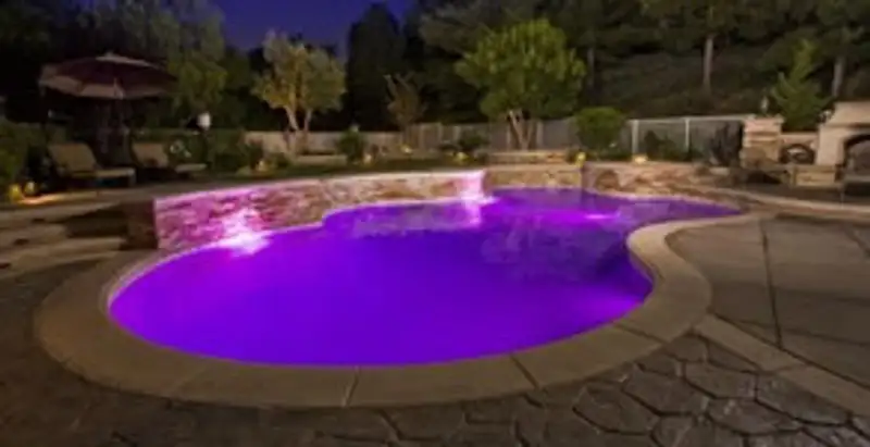 pool light installation and repair services illuminating a residential swimming pool in Cleveland, OH