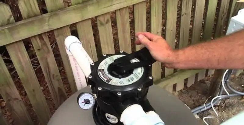 pool pumps service showing professional adjustment of pool pump control system in Cleveland, OH