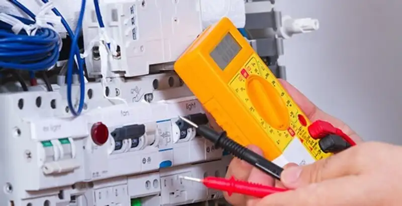 Residential electrician testing home electrical panel for safety and performance in Cleveland, OH