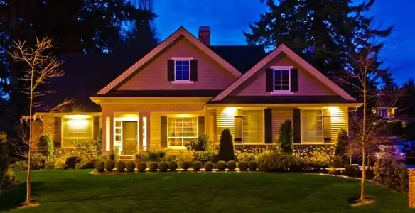 security light installation services illuminating a residential exterior at night in Cleveland, OH