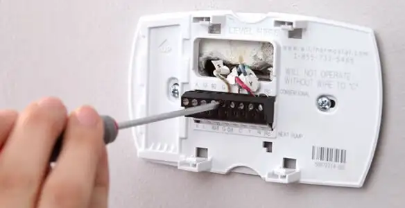 Thermostat installation service with proper wiring and secure wall mounting in Cleveland, OH