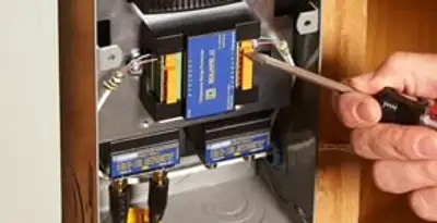 Whole home surge protection device being installed by a licensed electrician to protect electrical systems in Cleveland, OH